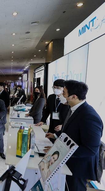 MINT Lift exhibition booth with staff